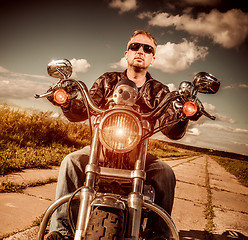 Image showing Biker on a motorcycle