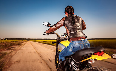 Image showing Biker girl on a motorcycle