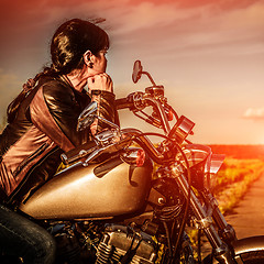 Image showing Biker girl on a motorcycle