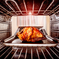 Image showing Roast chicken in the oven.