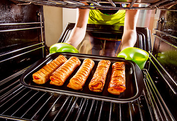 Image showing Cooking in the oven at home.