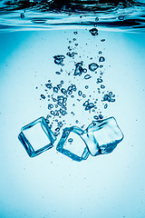 Image showing Ice cubes falling under water