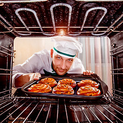 Image showing Chef cooking in the oven.