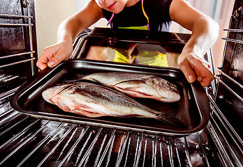 Image showing Cooking Dorado fish in the oven.