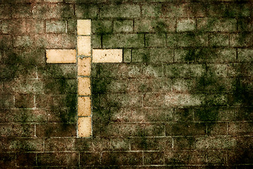 Image showing cross of christ built into a brick wall