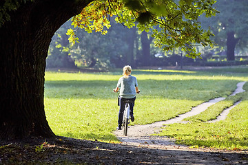 Image showing Woman on the bicycle in park