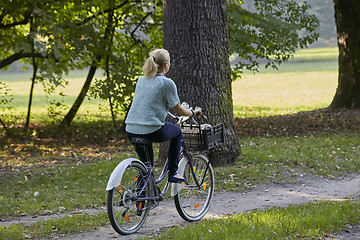 Image showing Woman on the bicycle in park