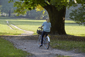 Image showing Woman on the bicycle in park