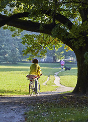 Image showing Woman on the bicycle in park