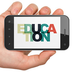 Image showing Education concept: Hand Holding Smartphone with Education on  display