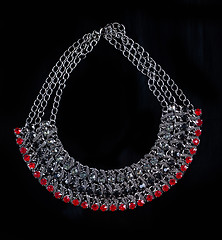 Image showing luxury red necklace on black stand