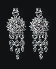 Image showing earrings with jewels on the black