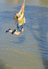 Image showing girl swinging