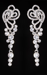 Image showing earrings with jewels on the black