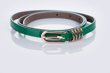 Image showing thin green female belt buckle with fine