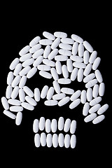 Image showing face of white oblong tablets 