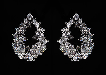 Image showing earrings with jewels on the black