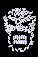 Image showing face of white oblong tablets 