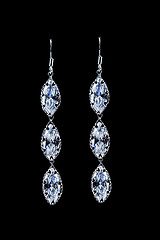 Image showing earrings with jewels on the black