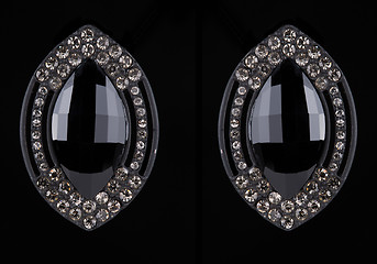 Image showing earrings with jewels on the black