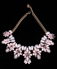 Image showing luxury pink necklace on black stand