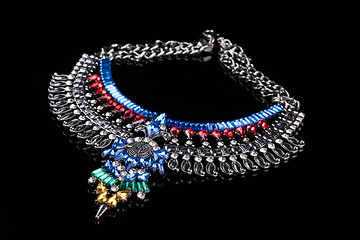 Image showing metal necklace with red and blue stones