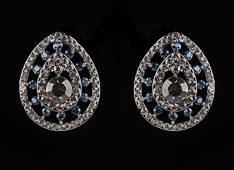 Image showing earrings with jewels on the black