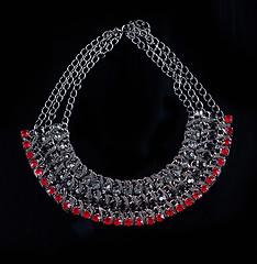 Image showing luxury red necklace on black stand