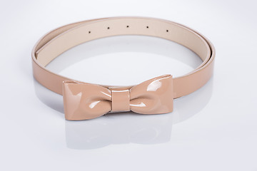 Image showing beige leather Women\'s belt with rhinestones