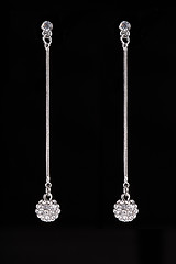 Image showing earrings with jewels on the black