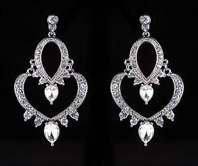 Image showing earrings with jewels on the black