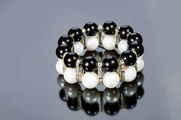 Image showing bracelet of pearls on a gray background