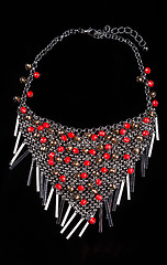 Image showing luxury red necklace on black stand