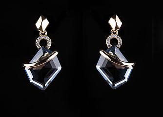 Image showing earrings with jewels on the black