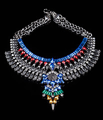 Image showing metal necklace with red and blue stones