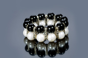 Image showing bracelet of pearls on a gray background