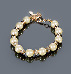 Image showing bracelet of pearls on a gray background