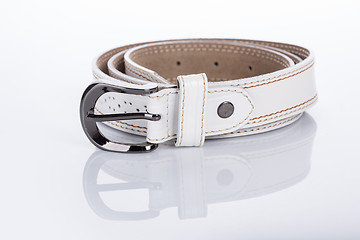 Image showing thin white female belt buckle with fine