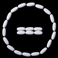 Image showing stop sign of white oblong tablets 