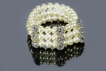 Image showing bracelet of pearls on a gray background