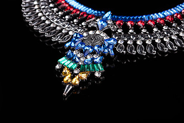 Image showing metal necklace with red and blue stones