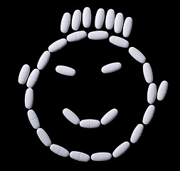 Image showing face of white oblong tablets 