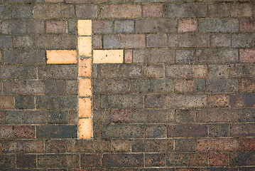 Image showing cross of christ built into a brick wall