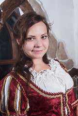 Image showing Attractive woman in red dress of retro style