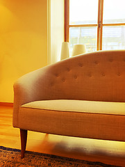 Image showing Elegant sofa in a sunlit room with big window