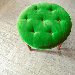 Image showing Green velvet stool on tiled floor