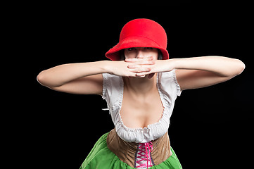 Image showing German pretty girl with red hat covers mouth