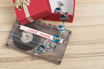 Image showing Audio cassette tape and bracelet