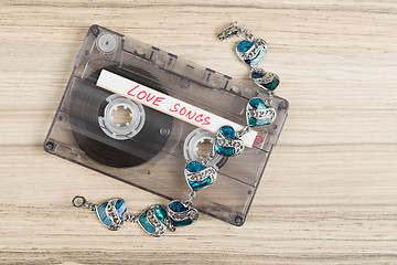 Image showing Audio cassette tape and bracelet