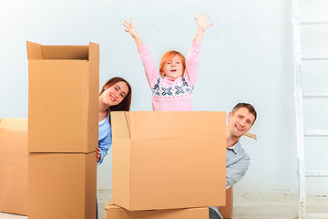 Image showing The happy family  during repair and relocation